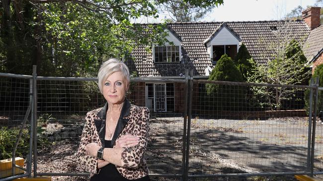 Patricia Evans at the once-luxurious mansion at Park Ridge. The mansion was left vacant and to rack and ruin after Logan City Council bought it in 2008. Picture: AAP/Jono Searle