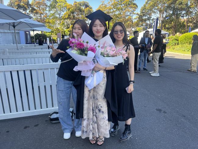 Tommy Kanda, Jo Chong (Master of Information Technology) and Qien Foo at the University of Melbourne graduations held at the Royal Exhibition Building on Friday, December 13, 2024. Picture: Jack Colantuono