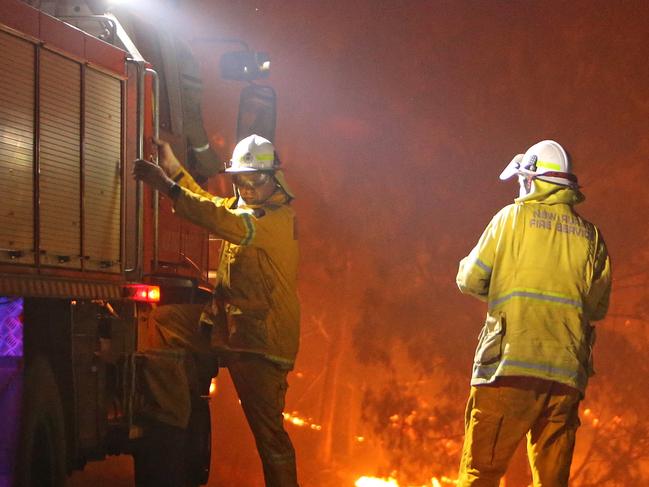 04/01/2020: RFS firefighters work to contain a fire that threatens the township of Bemboka, Northwest of Bega while bushfires continue to ravage the Southern Coast of N.S.W. Stuart McEvoy/The Australian.