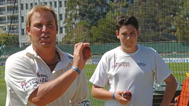 Shane Warne with competition winner Scott Boland at the Junction Oval