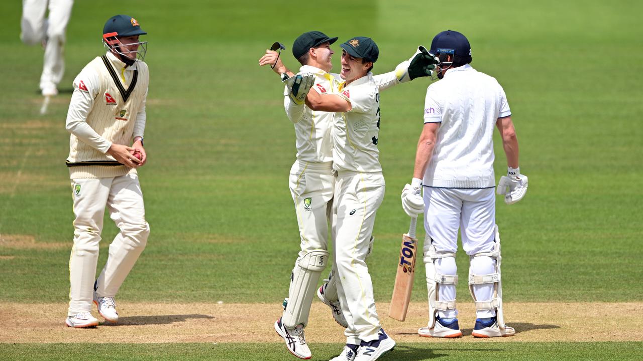 Australian wicketkeeper Alex Carey and captain Pat Cummins celebrate the stumping. Photo by Stu Forster/Getty Images