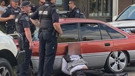 Police are seen arresting a man at Brompton in May 2022. Picture: Nick Blain