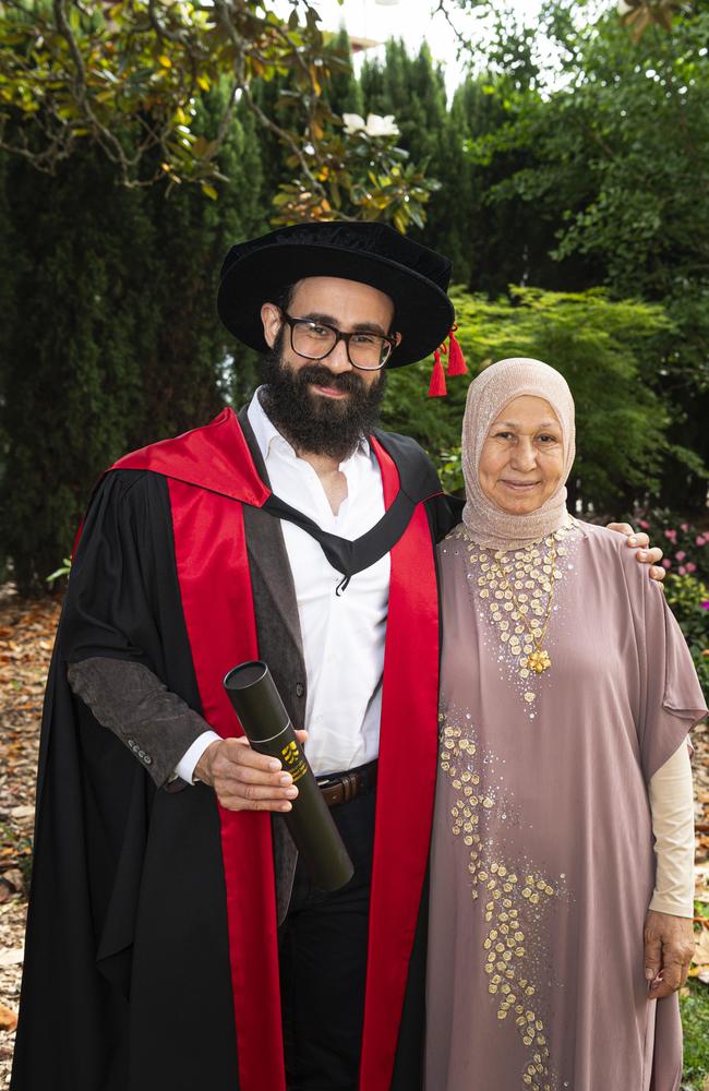 PhD graduate Basem Aly is congratulated by mum Samia Elhabab at a UniSQ graduation ceremony at The Empire, Wednesday, October 30, 2024. Picture: Kevin Farmer