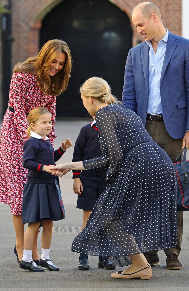 Helen Haslem, head of the lower school, greets Princess Charlotte as she arrives for her first day of school at Thomas’s Battersea in London. Picture: Aaron Chown/Getty