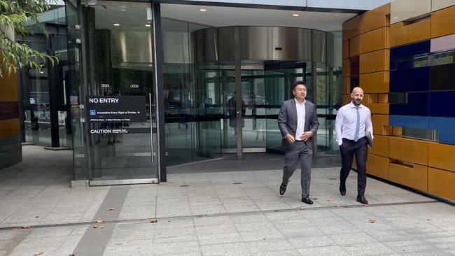 Blockchain Global founder Allan Guo and his solicitor, George Tsogas, outside the Federal Court.