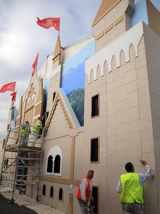 Finishing touches ... workers install the German-themed Emirates marquee. Picture: Alex Coppel