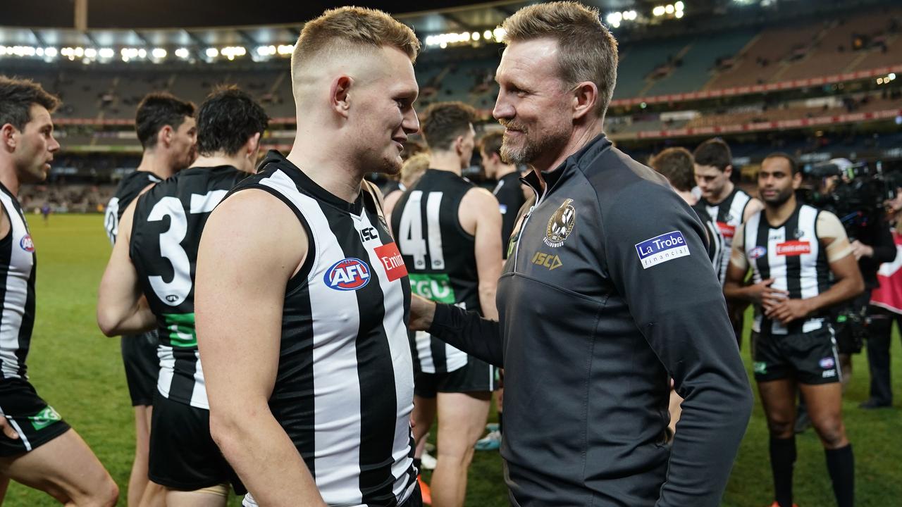 Adam Treloar of the Magpies and Nathan Buckley, coach of the Magpies talk after winning the Round 23 AFL match between the Collingwood Magpies and the Essendon Bombers at the MCG in Melbourne, Friday, August 23, 2019. (AAP Image/Scott Barbour) NO ARCHIVING, EDITORIAL USE ONLY