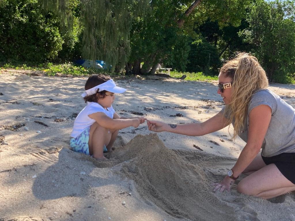 Little Adelynn with her Auntie Angela at the beach in the Whitsundays.