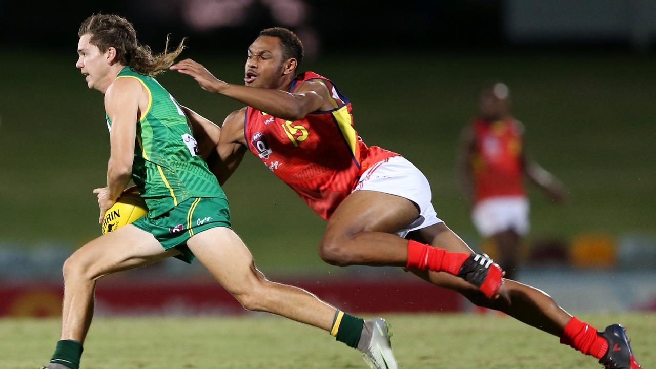 AFL Cairns All Stars playing against the Cairns Indigenous/South Pacific team at Cazalys Stadium. Cairns All Stars' Corey Flint and Indigenous/South Pacific's Hamiso Tabuai-Fidow. PICTURE: STEWART MCLEAN