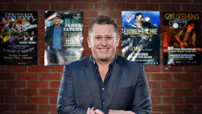 Managing director at Space Events Phil Rankine with promotional posters for acts he has brought to Adelaide. Picture: Bianca De Marchi