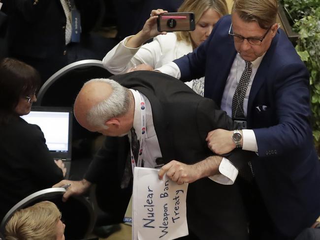 A man is removed by security ahead of a press conference between Donald Trump and Vladimir Putin at the Presidential Palace in Helsinki, Finland. Picture: AP Photo/Markus Schreiber