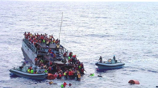 The sinking refugee boat.