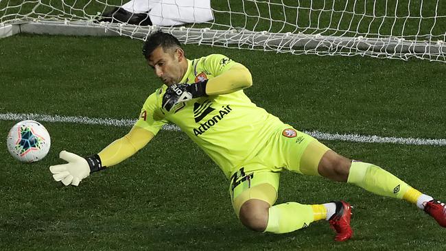 Jamie Young makes one of several stunning saves against Sydney FC in Newcastle.