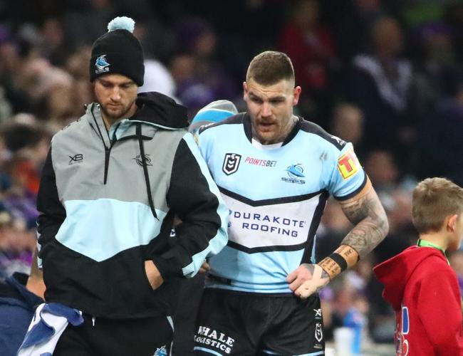 Josh Dugan of the Sharks leaves the field injured during the Round 17 NRL match between the Melbourne Storm and the Cronulla Sharks at AAMI Park.