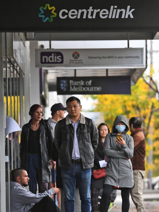 People queue up outside a Centrelink office in Melbourne, Picture: AFP