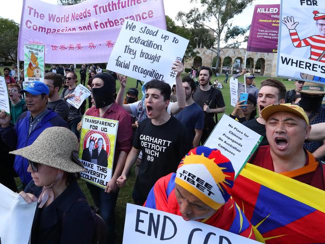 Drew Pavlou (centre) at a protest against the UQ Confucius Institute in 2020