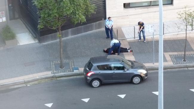 Police inspect the body of Farhad Khalil Mohammad Jabar after he was shot outside NSW Police headquarters in Parramatta after Farhad murdered Curtis Cheng. Source: Supplied