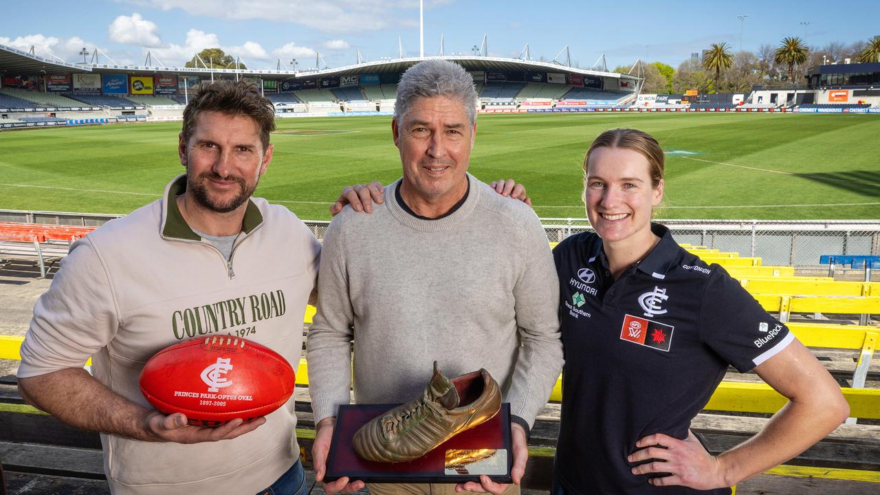 Jarrad Waite with the match ball from the final AFL game at Ikon Park in 2005, along with Stephen Kernahan with the bronzed boot from his 200th match at the venue in 1996. AFLW star Breann Moody will play in the 1000th competitive Carlton game at the Princes Park venue on Saturday night. Picture: Mark Stewart