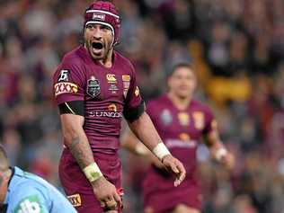 BEST EVER: Johnathan Thurston exalts during the 52-6 walloping of the Blues in Origin III in 2015. The Cowboys and Maroons maestro will be a future Immortal without doubt. Picture: AAP Image/Dave Hunt