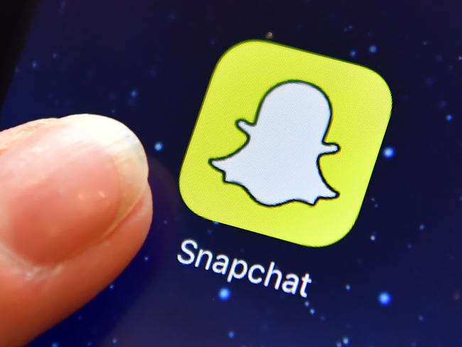 LONDON, ENGLAND - AUGUST 03: A finger is posed next to the Snapchat app logo on an iPad on August 3, 2016 in London, England.  (Photo by Carl Court/Getty Images)