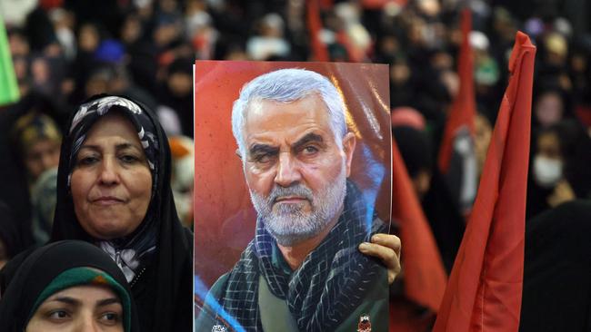 An Iranian woman holds a portrait of slain top Iranian commander Qasem Soleimani. Picture: AFP