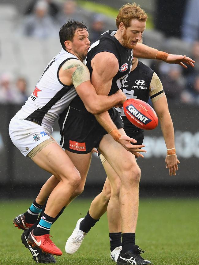 Travis Boak wraps up Carlton ruckman Andrew Phillips. Picture: Quinn Rooney/Getty Images