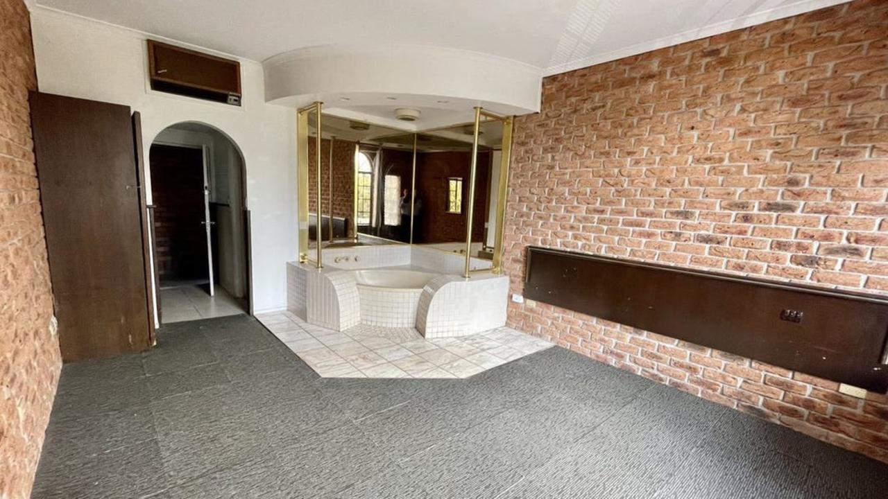 The one-bedroom, one-bathroom home has a unique bathtub feature in the living/bedroom area. Picture: Hockingstuart Frankston.