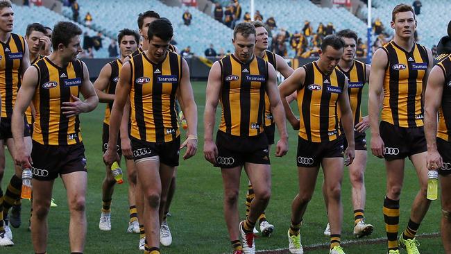 Hawthorn players leave the MCG after the loss to Gold Coast. Picture: Michael Klein