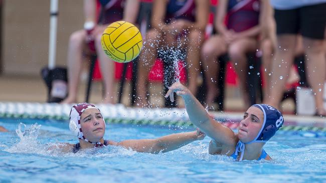 Mermaids Elyanna Astone, left, looks to intercept a pass to NSW's Saskia Dunn. Picture: Jerad Williams