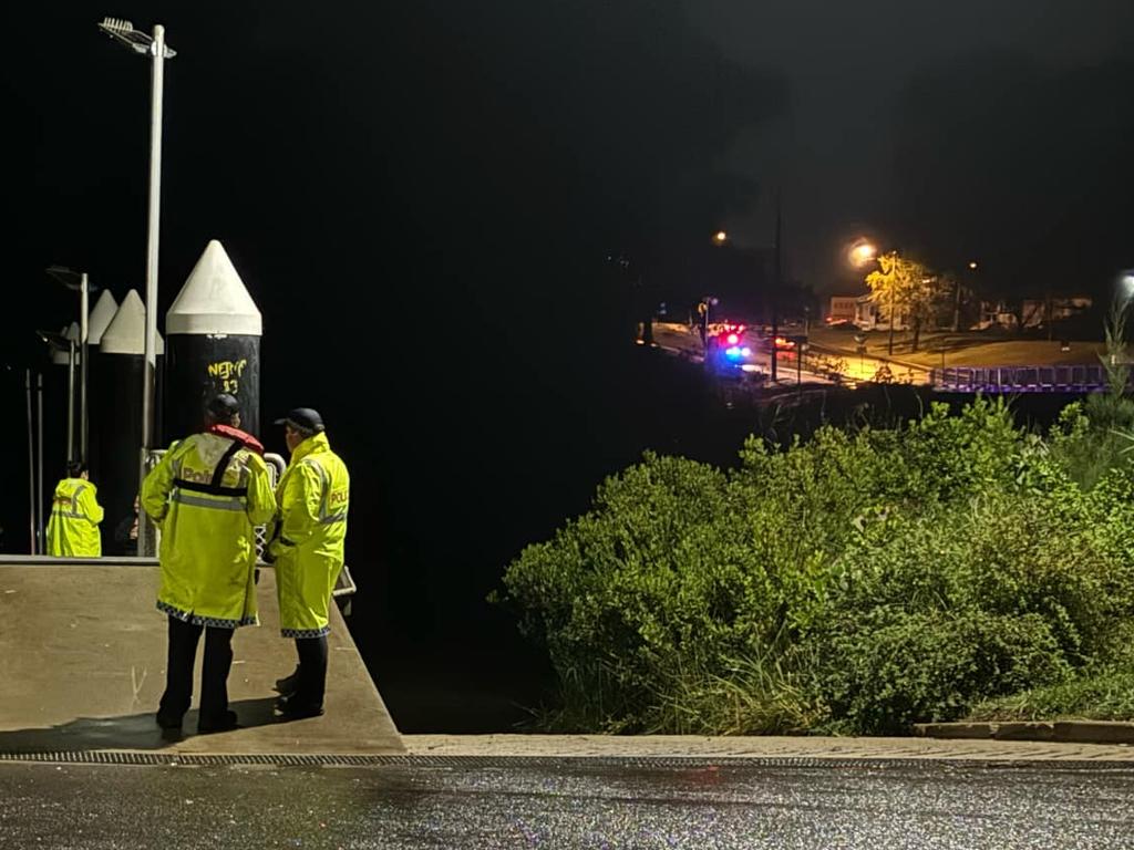 The search at the Lamington Bridge, Tinana on Tuesday night.