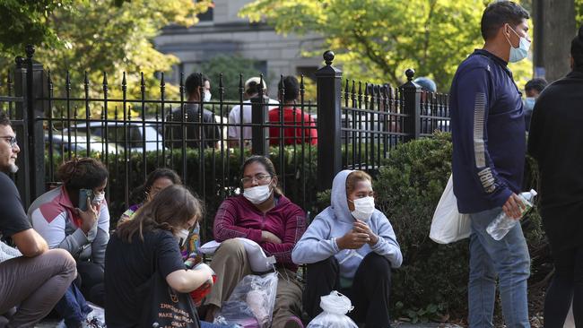 Migrants from Central and South America outside the residence of US Vice President Kamala Harris. Picture: AFP