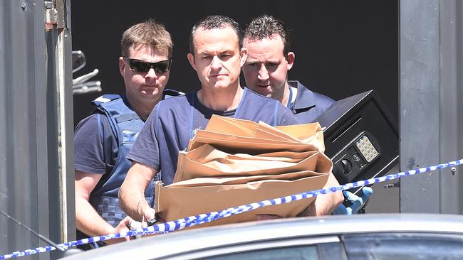 Police retrieve evidence and a safe from Finks HQ in Ringwood.Picture:Rob Leeson.