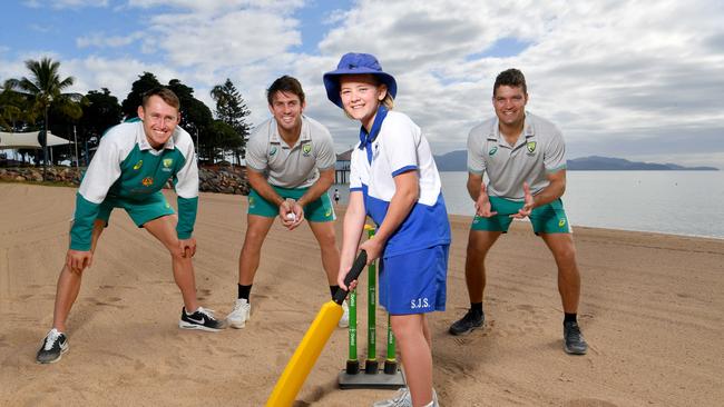 BEST PHOTOGRAPHS 2022. Evan Morgan. Aussie cricketers Marnus Labuschagne, Mitch Marsh and Alex Carey playing beach cricket with Lizzie Griffiths, 10, from St Joseph's on the Strand. Picture: Evan Morgan.