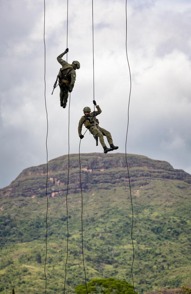 Colombian National Police fast rope their members into the coca farms. Picture: Jason Edwards