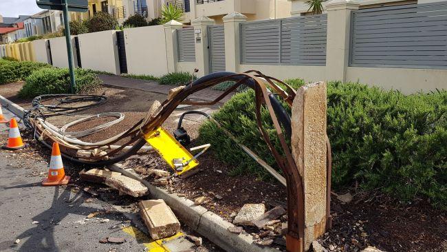 Strong winds blow over a stobie pole in Henley Beach. Picture: Con Polychronis