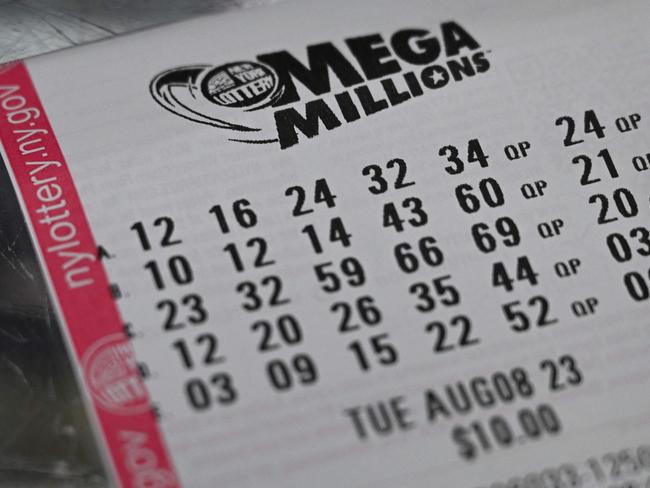 A Mega Millions lottery ticket in New York City on August 08, 2023. If won, it would be the largest prize awarded in the lottery's history at 1.58 billion USD, with a 757.2 million USD cash option. (Photo by ANGELA WEISS / AFP)