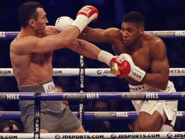 British boxer Anthony Joshua, right, fights Ukrainian boxer Wladimir Klitschko for Joshua's IBF and the vacant WBA Super World and IBO heavyweight titles at Wembley stadium in London, Saturday, April 29, 2017. (AP Photo/Matt Dunham)