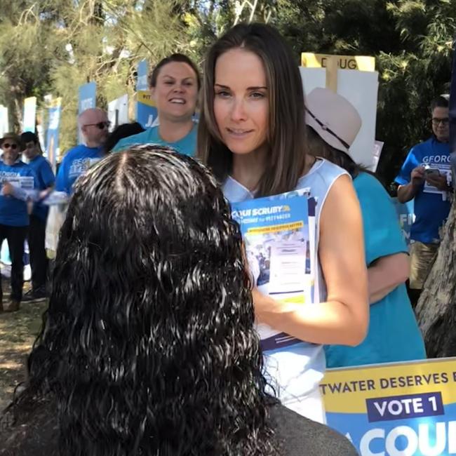 Independent candidate in the Pittwater by-election, Jacqui Scruby, taking with a voter outside the Ted Blackwood Memorial Hall in Warriewood, on Saturday. She has vowed to “hit the ground running” when she enters parliament. Picture: Jim O’Rourke