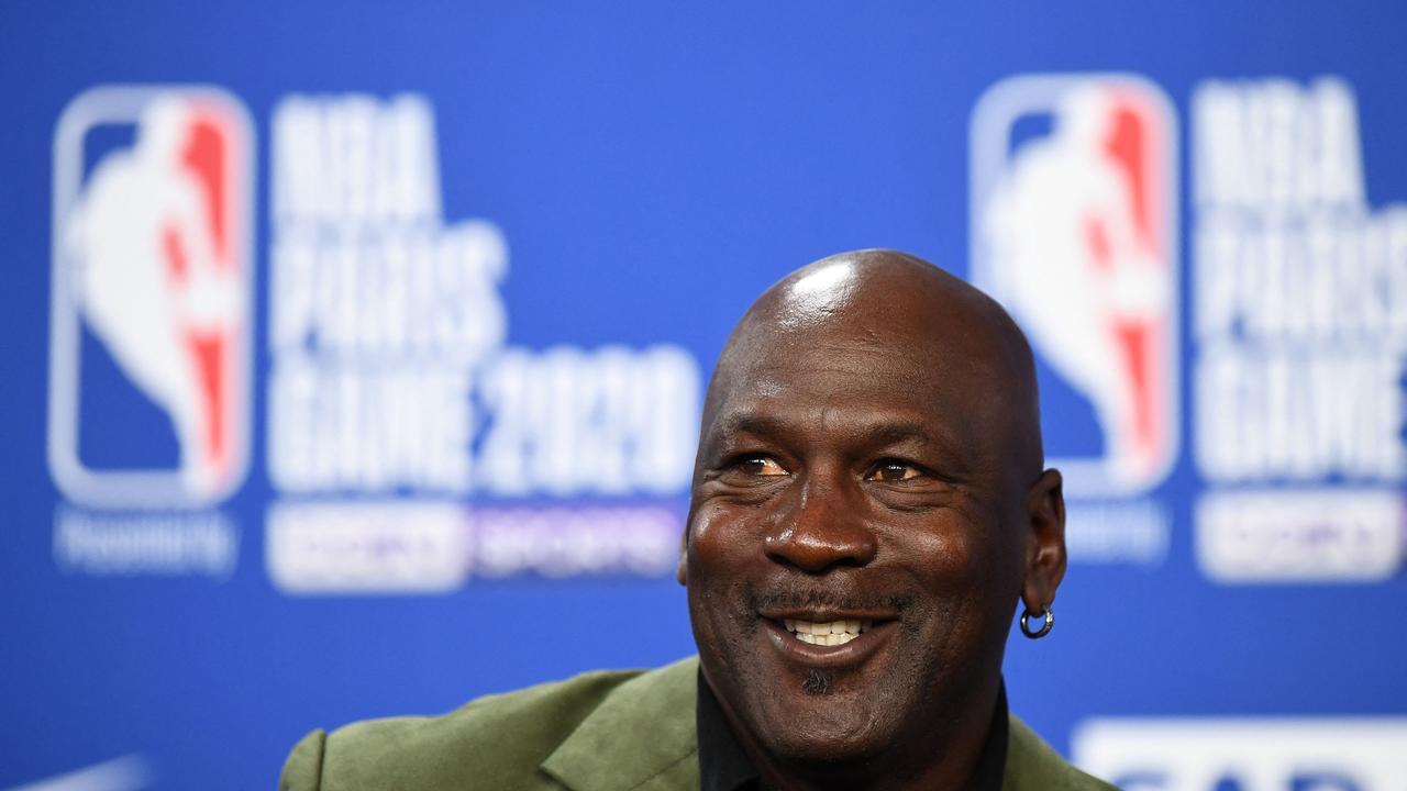 (FILES) Former NBA star and owner of Charlotte Hornets team Michael Jordan looks on as he addresses a press conference ahead of the NBA basketball match between Milwakuee Bucks and Charlotte Hornets at The AccorHotels Arena in Paris on January 24, 2020. Basketball legend Michael Jordan will sell his majority stake in NBA's Charlotte Hornets to an investment consortium, the team announced June 16, 2023. (Photo by FRANCK FIFE / AFP)