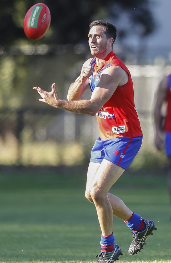 Tyler Jones gets away a handball for Port Colts. Picture: Valeriu Campan