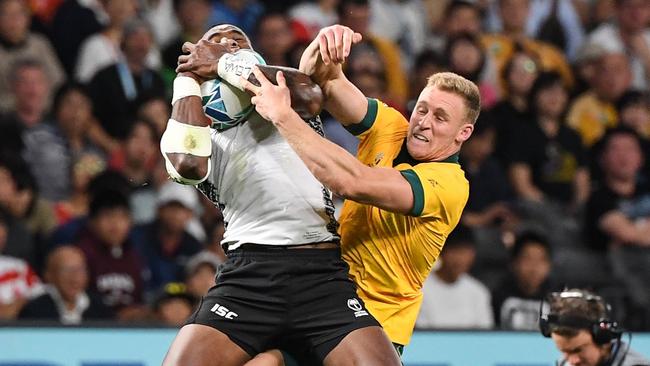 Reece Hodge competes with former NRL star Semi Radradra. Picture: William West/AFP