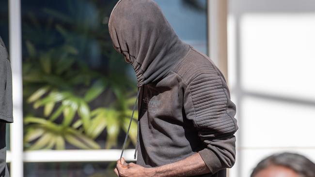 Joseph Marrday hides his face from the media outside court on Monday. Picture: Pema Tamang Pakhrin