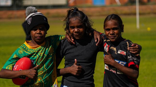 Melbourne Demons players Shane McAdam and Andy Moniz-Wakefield went to Santa Teresa ahead of the 2025 AFL game in Alice Springs. Picture: Melbourne Demons