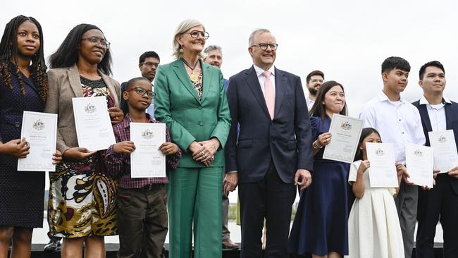 Prime Minister Anthony Albanese and Governor-General Sam Mostyn with recipients of Australian Citizenship at the National Citizenship and Flag Raising Ceremony on the banks Lake Burley Griffin in Canberra. Picture: NewsWire / Martin Ollman