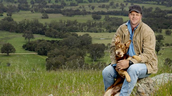 The Falls Pastoral farm manager Tim Bennett with his Kelpie named Tank. Picture: Zoe Philips