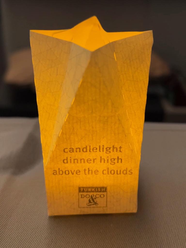 The first time I’ve had a candlelit dinner on a plane. Picture: news.com.au