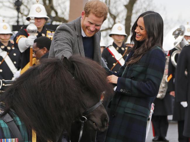 Prince Harry and his fiancee Meghan Markle meet a Shetland Pony as they arrive at Edinburgh Castle. Picture: AP/Frank Augstein