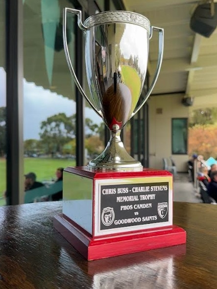 Goodwood Saints and PHOS Camden will play for the Chris Buss-Charlie Stevens Memorial Trophy in their Division 2 Adelaide Footy League game on Saturday.