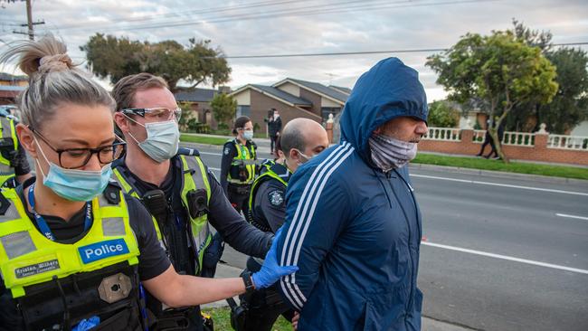 Police threatened to use pepper spray in a tense stand-off with anti-lockdown protesters in Dandenong. Officers clashed with a group of about 100 people who marched along Kirkham Rd about 5.20pm. Picture: Jason Edwards