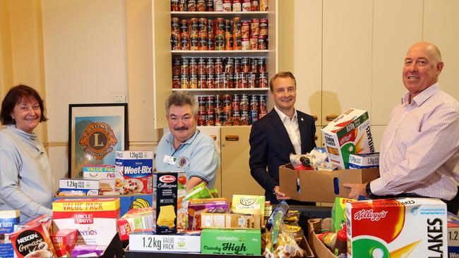 Community Northern Beaches on a food drive for those in need. Leoni Bishop (Lions), Nigel Jeny (Lions), James Griffin and John Kelly.